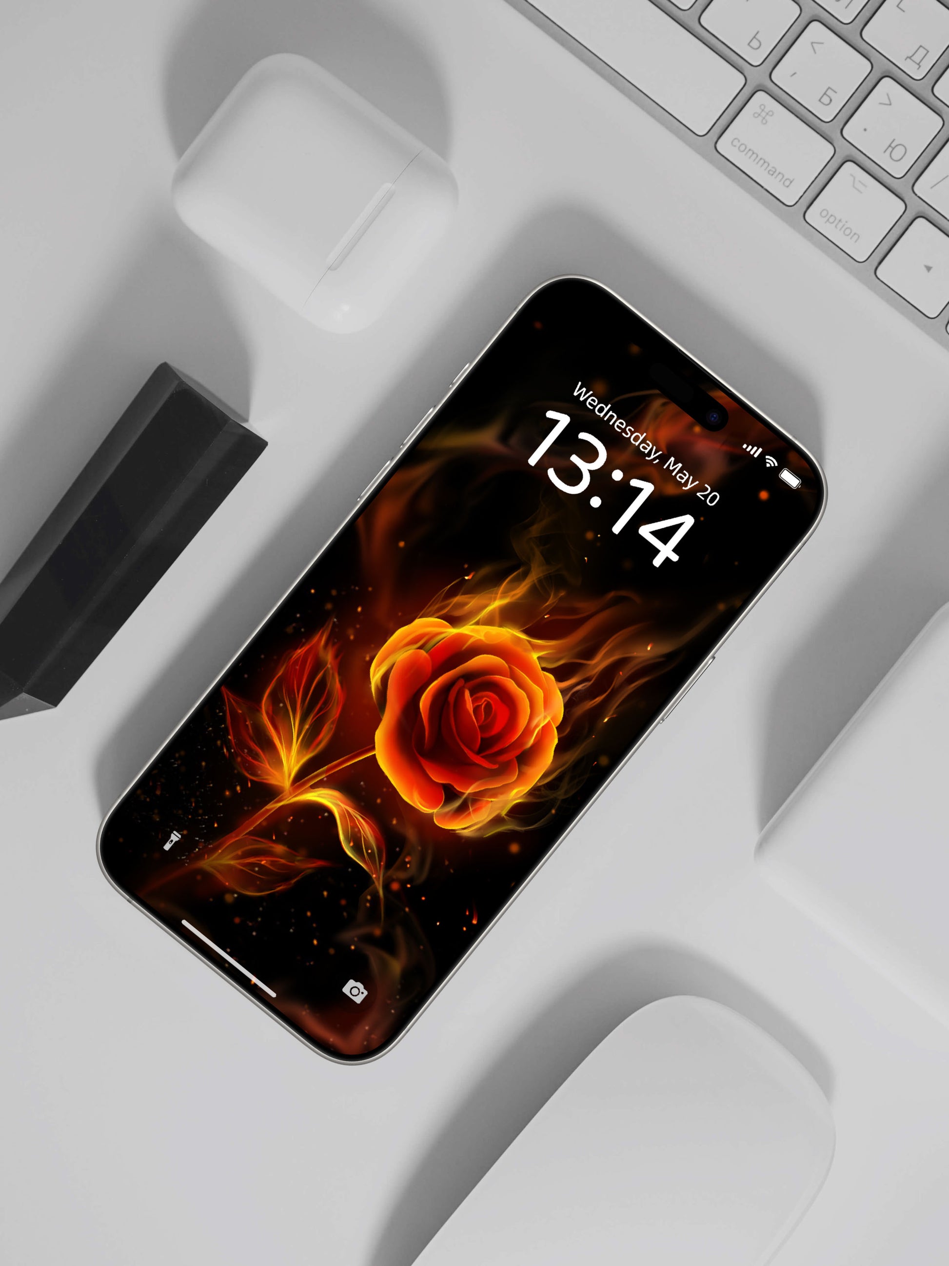 Phone wallpaper displaying a fiery orange rose with flame details, perfect for streetwear and gothic clothing enthusiasts.