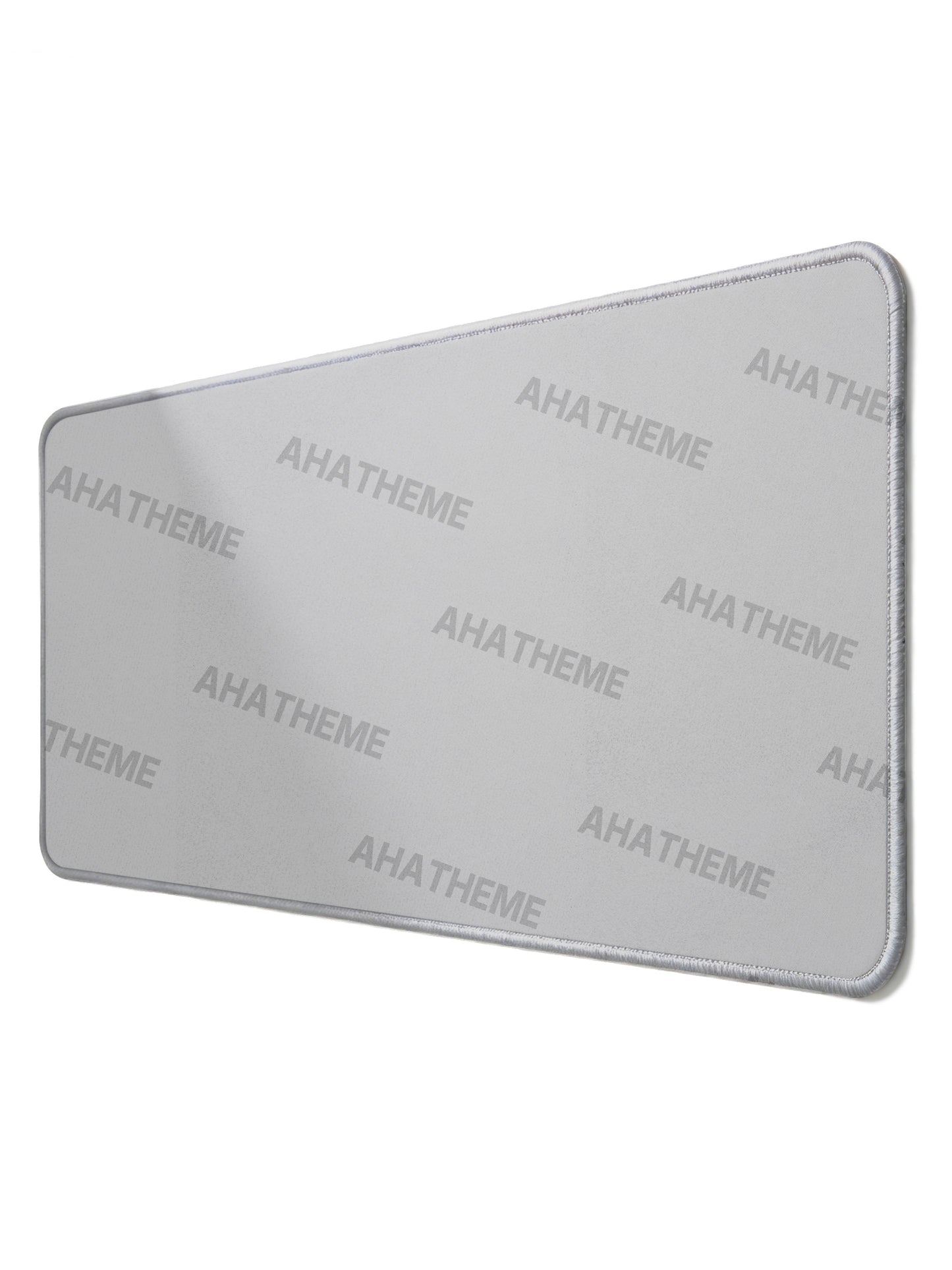 Rectangular custom mousepad with smooth gray surface and stitched edges, perfect for streetwear and alternative fashion.