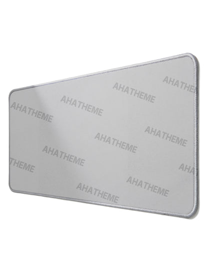Rectangular custom mousepad with smooth gray surface and stitched edges, perfect for streetwear and alternative fashion.